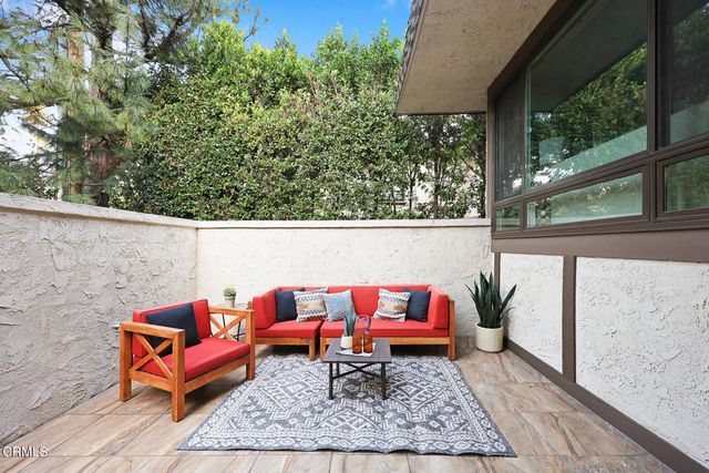 a view of a livingroom with furniture and wooden floor
