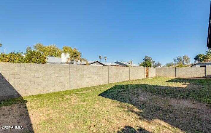 2536 East Commonwealth Circle Chandler, AZ 85225 - Photo 13 of 34 a view of a yard with a building in the background