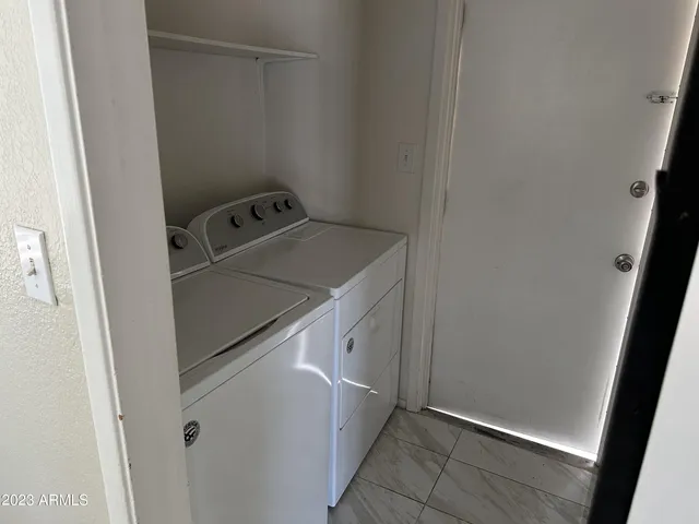 a utility room with washer and dryer