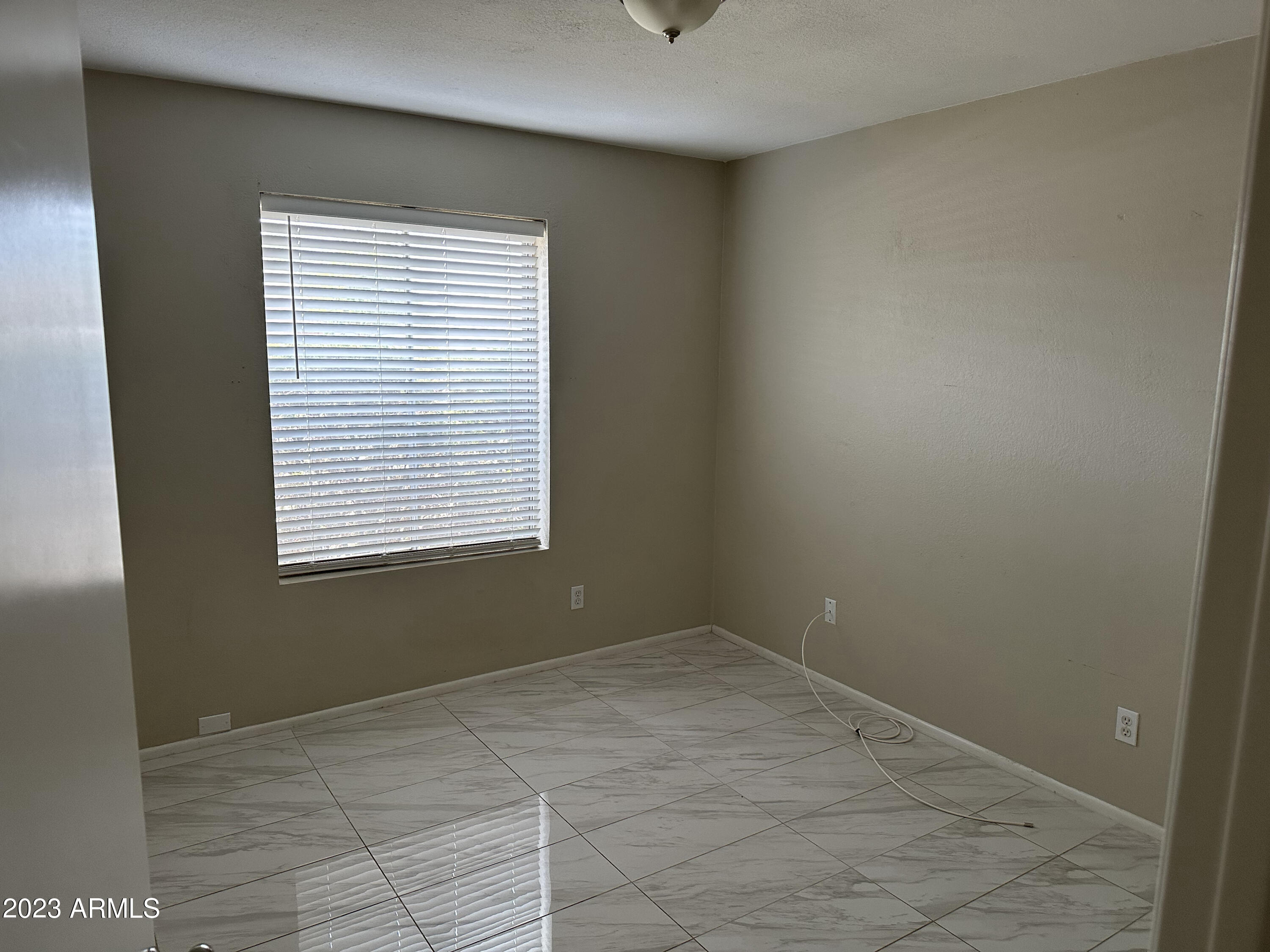 2536 East Commonwealth Circle Chandler, AZ 85225 - Photo 24 of 34 a view of an empty room with a window