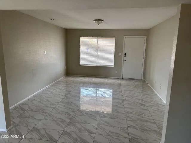 a kitchen with a sink refrigerator and microwave