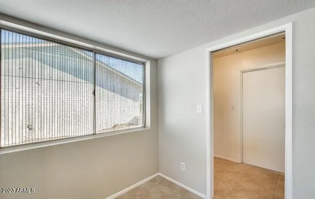 a view of an empty room with a window