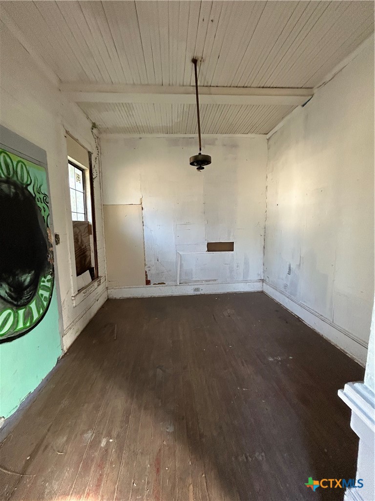 701 East River Street Victoria, TX 77901 - Photo 11 of 21 an empty room with wooden floor and windows