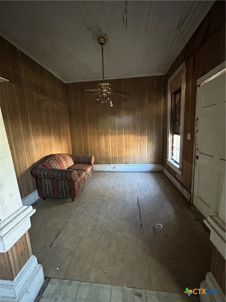 701 East River Street Victoria, TX 77901 - Photo 3 of 21 a living room with furniture and a chandelier