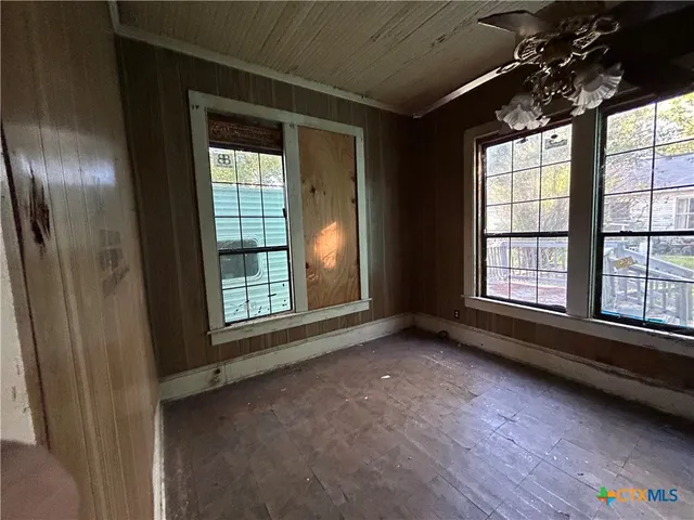 a view of an empty room with a window