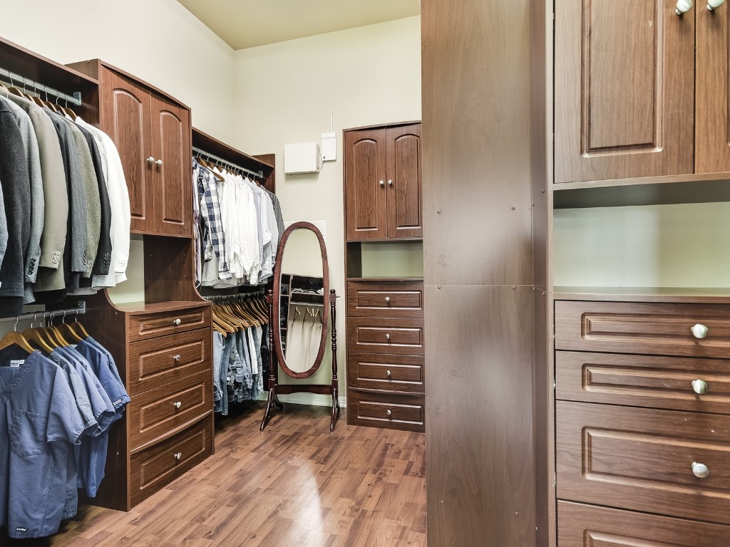13301 Country Trails Lane Austin, TX 78732 - Photo 16 of 40 Spacious Primary closet featuring wood finished floors