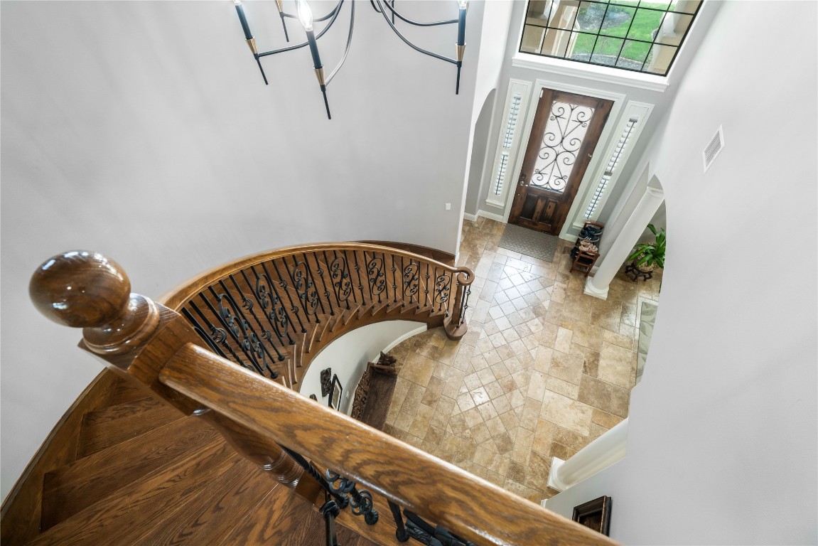 13301 Country Trails Lane Austin, TX 78732 - Photo 22 of 40 Entryway view from the top of the stairs with a high ceiling and baseboards