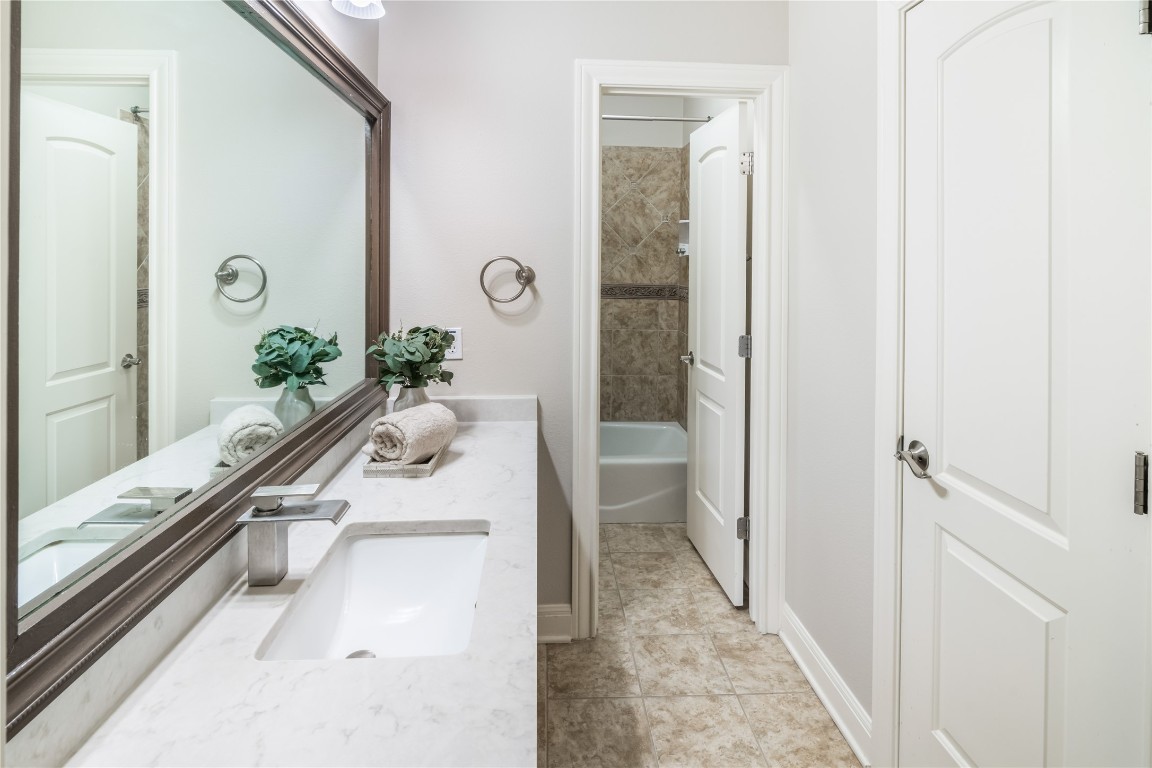 13301 Country Trails Lane Austin, TX 78732 - Photo 25 of 40 Full bath featuring quartz countertop, and tub/shower combo