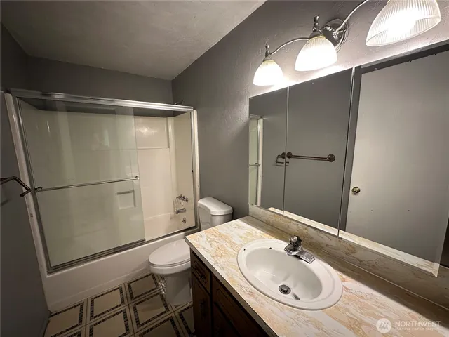 a bathroom with a sink and mirror