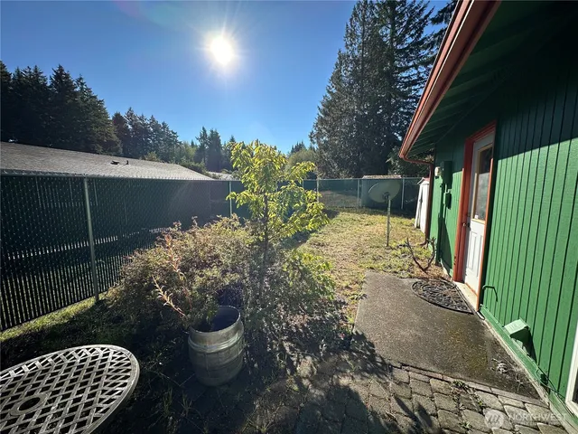 a view of a back yard of the house and a garden