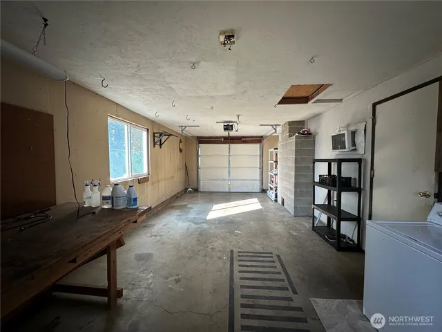 a view of a livingroom with furniture and a window
