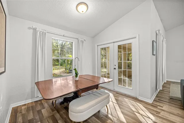 a dining room with furniture and window