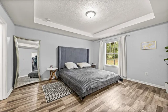 a kitchen with a sink a counter and cabinets