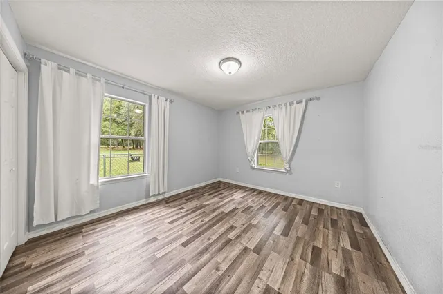 a view of room with hardwood floor