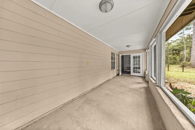 a backyard of a house with plants and trees