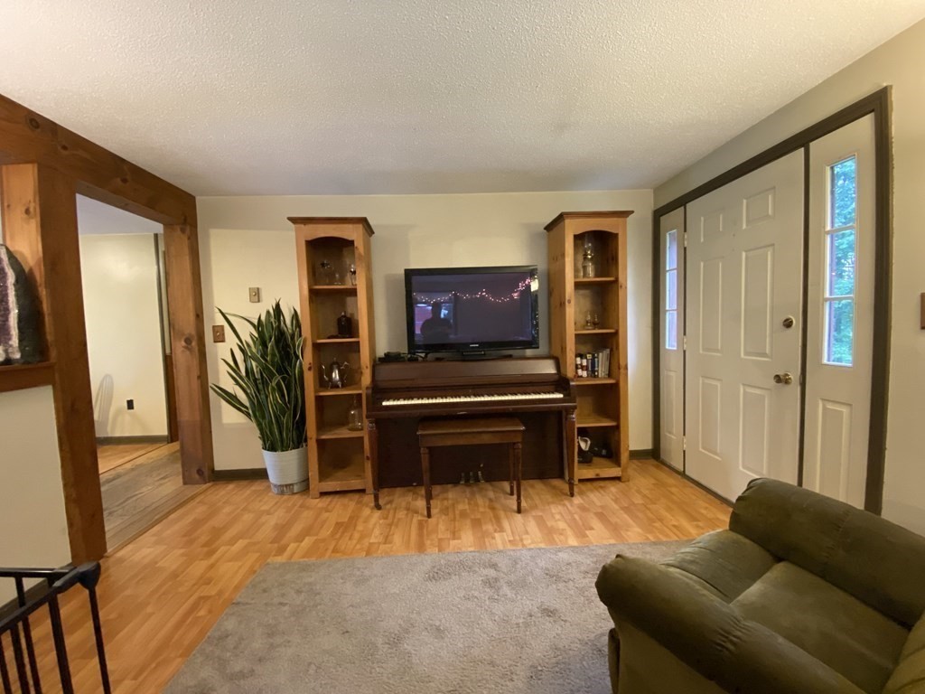 10 Whitney Road Phillipston, MA 01331 - Photo 20 of 41 a living room with furniture and a flat screen tv