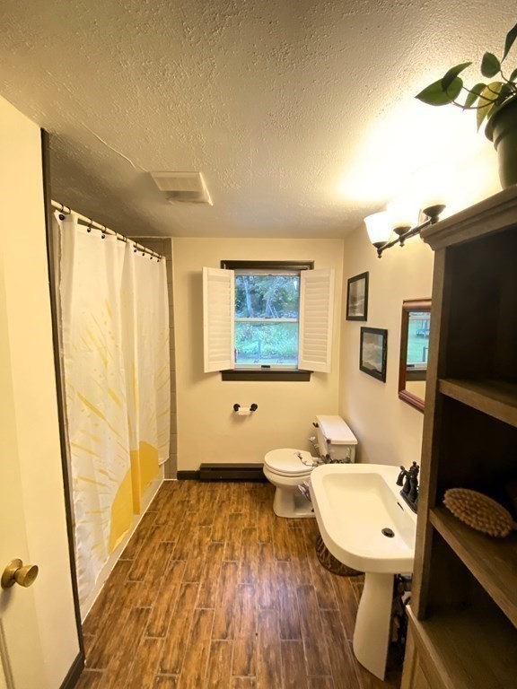 10 Whitney Road Phillipston, MA 01331 - Photo 21 of 41 a bathroom with a sink mirror bathtub and toilet