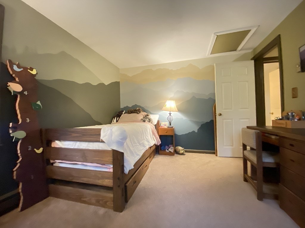 10 Whitney Road Phillipston, MA 01331 - Photo 25 of 41 a bedroom with a bed and wooden floor