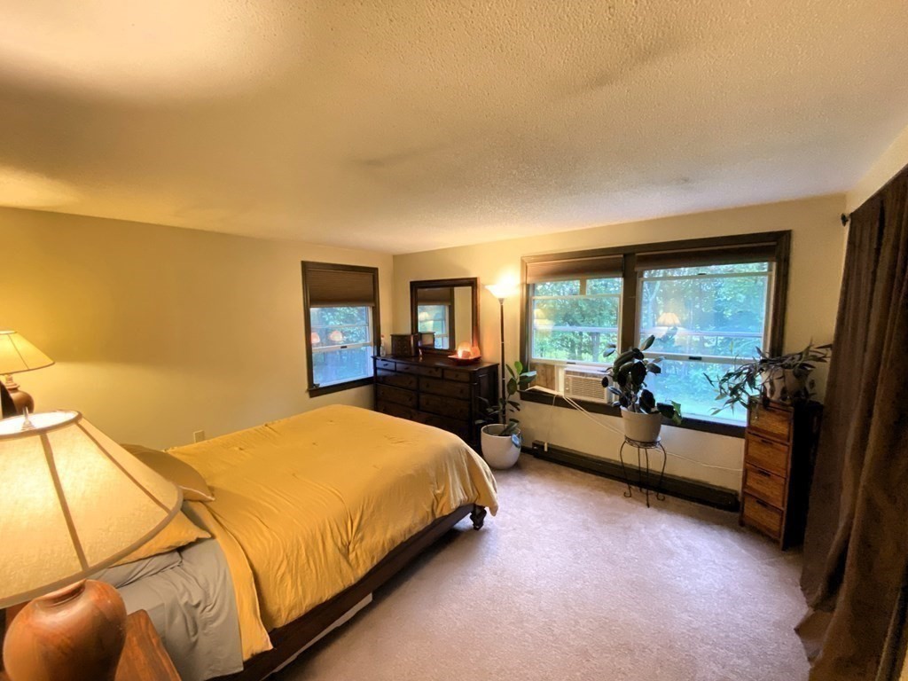 10 Whitney Road Phillipston, MA 01331 - Photo 27 of 41 a bed sitting in a bedroom next to a window
