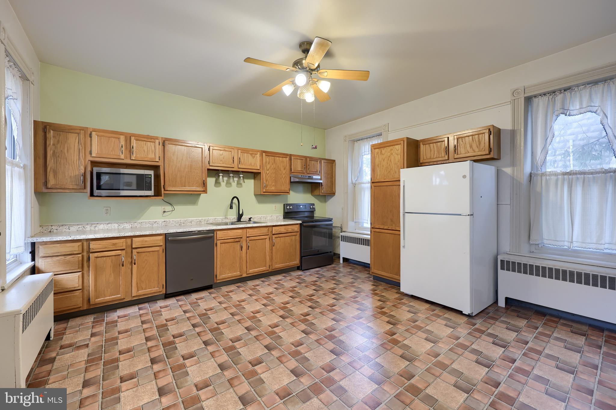 2926 Kutztown Road Reading, PA 19605 - Photo 13 of 49 a kitchen with a refrigerator sink and cabinets