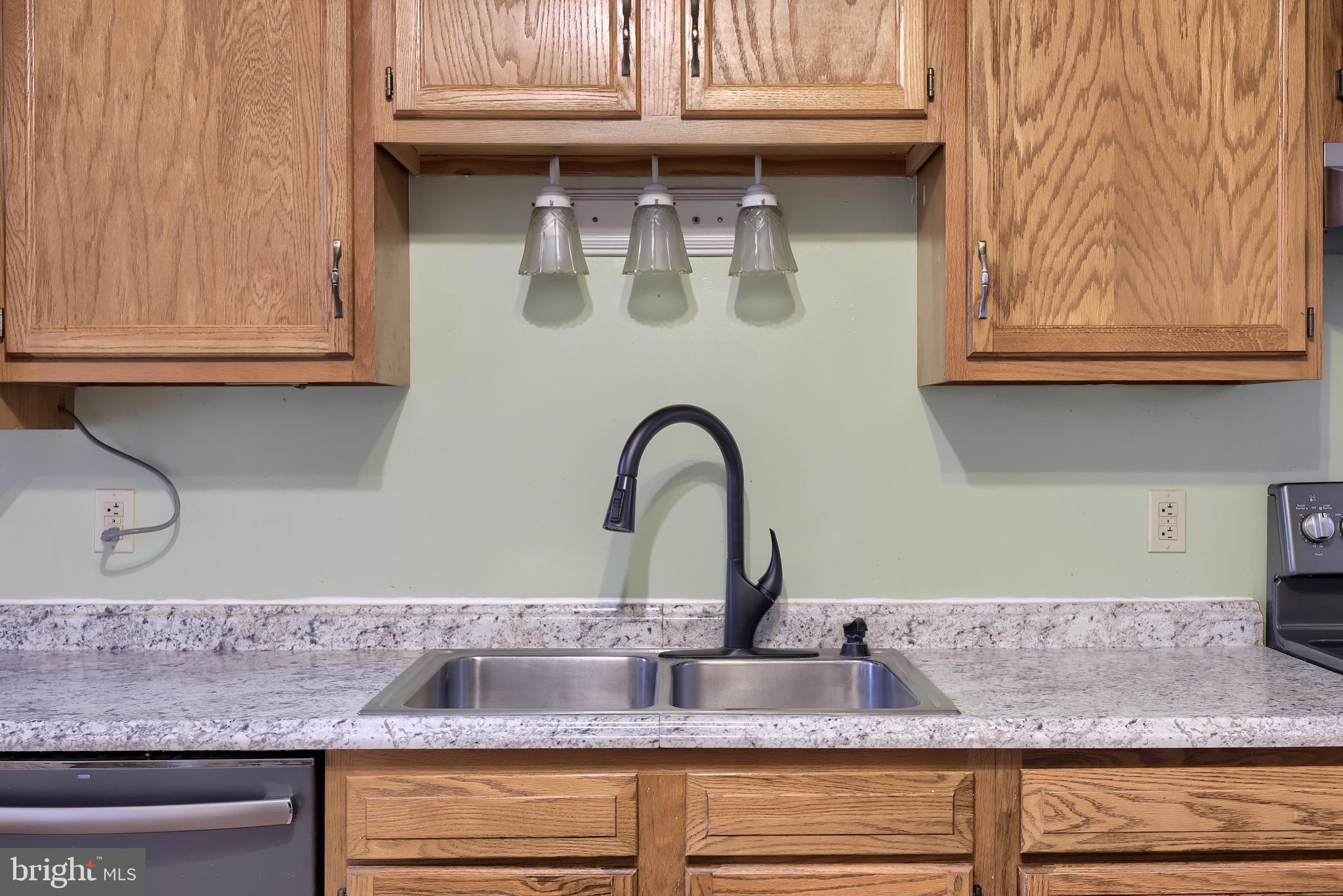 2926 Kutztown Road Reading, PA 19605 - Photo 16 of 49 a kitchen with granite countertop a sink and a stove
