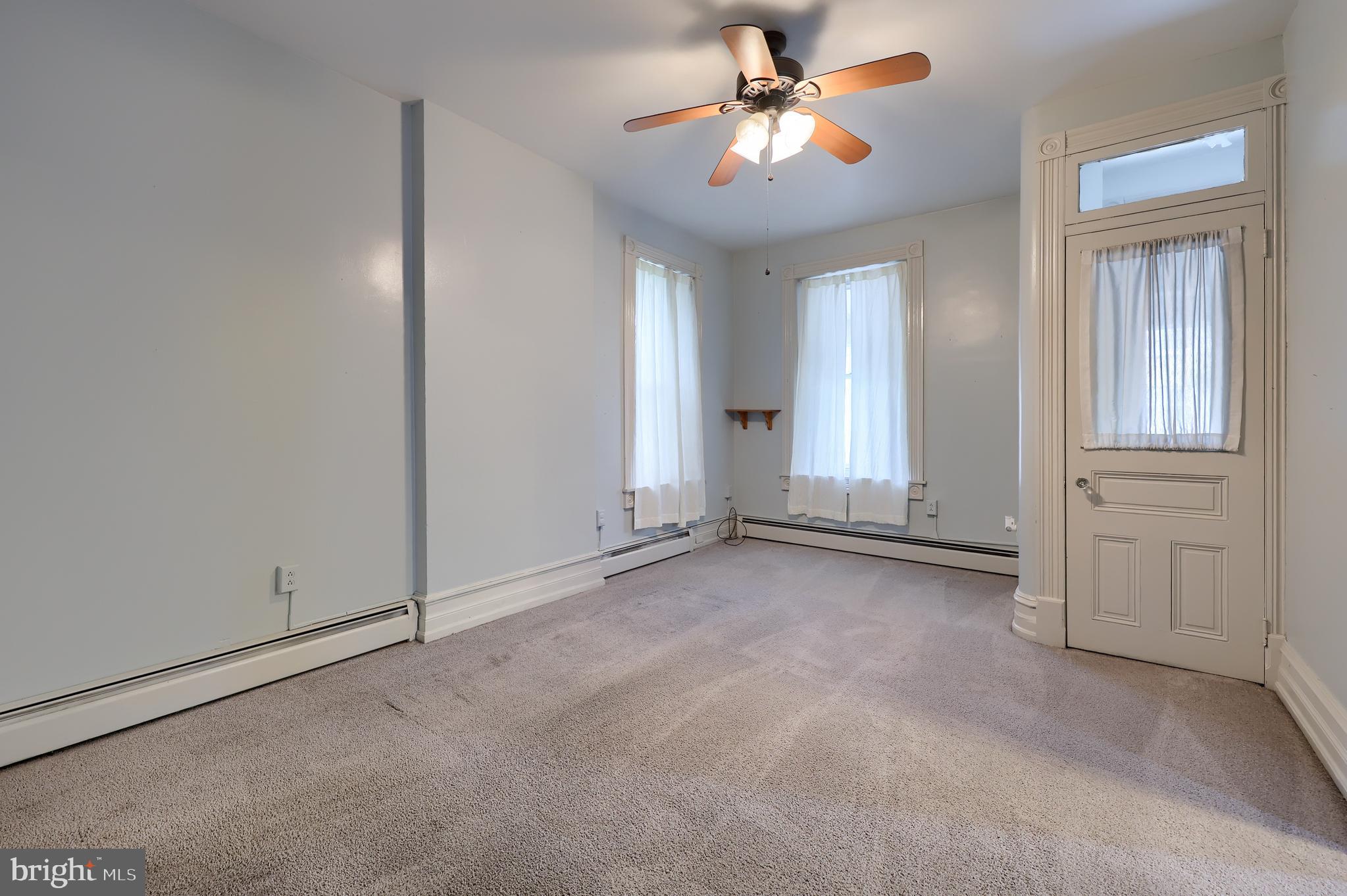 2926 Kutztown Road Reading, PA 19605 - Photo 20 of 49 an empty room with windows and fan