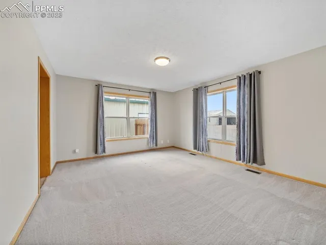a view of a balcony with wooden floor