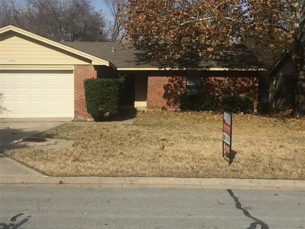 a view of a backyard of the house
