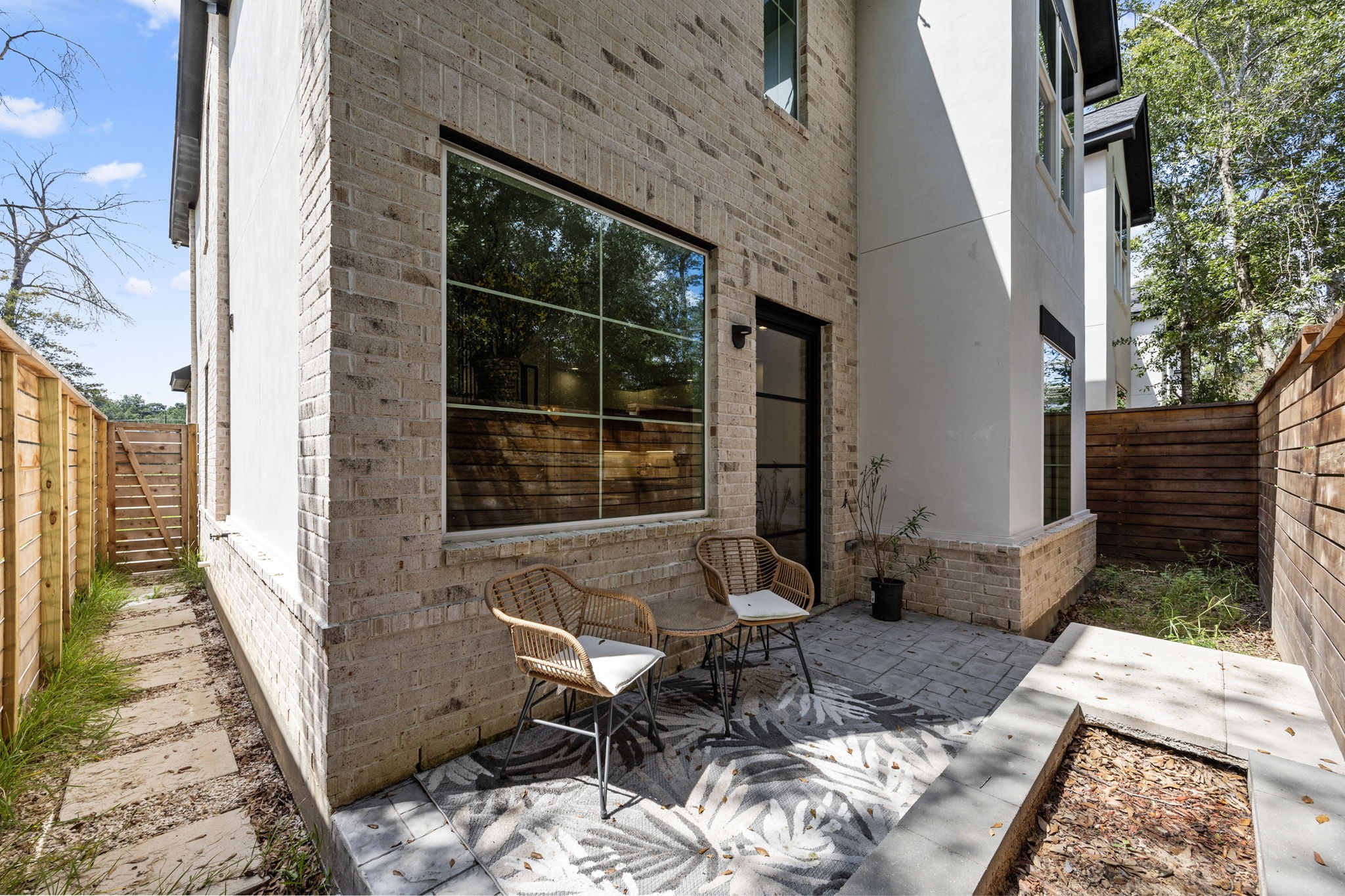 7934 Hennessy Lane, Unit 3 Spring, TX 77389 - Photo 35 of 36 a view of balcony with two chairs and a window