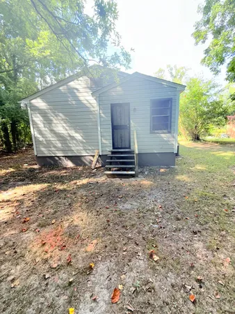 a view of a backyard of the house