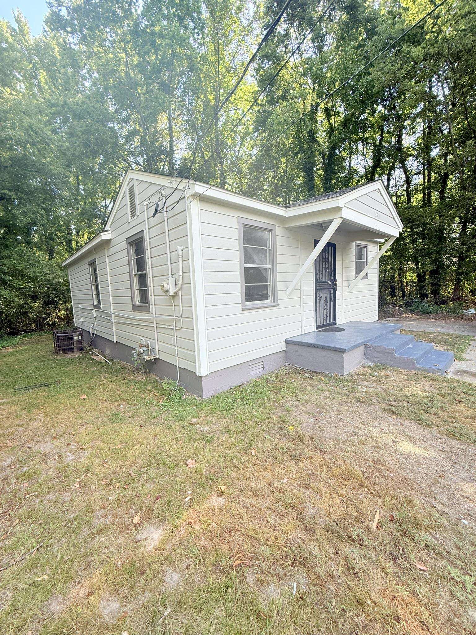 931 Calvin Road Memphis, TN 38109 - Photo 14 of 15 a view of a house with a yard