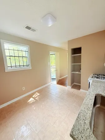 a bedroom with bed and window