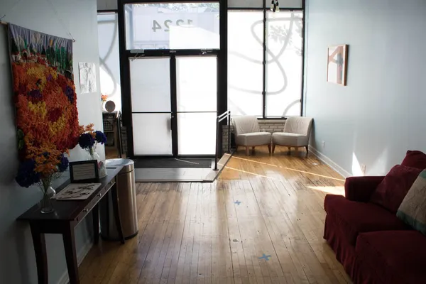 a living room with furniture and a window