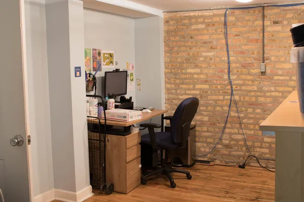 a view of a workspace with furniture