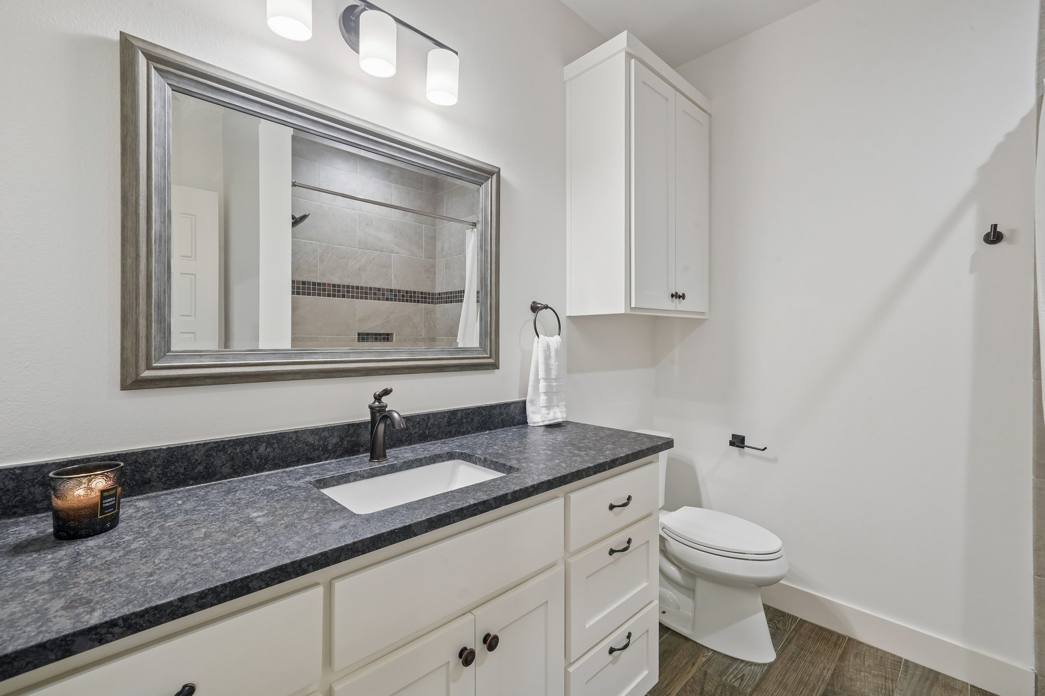 190 Magnolia Meadow Spring Branch, TX 78070 - Photo 15 of 29 A refined bathroom featuring rich stone counters and a coordinating vanity.