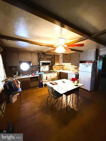 a open kitchen with a table and chairs