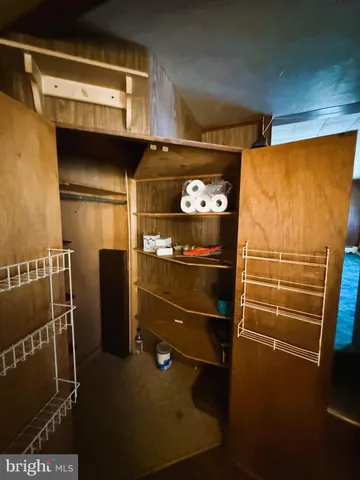 a view of a porch with furniture and garden