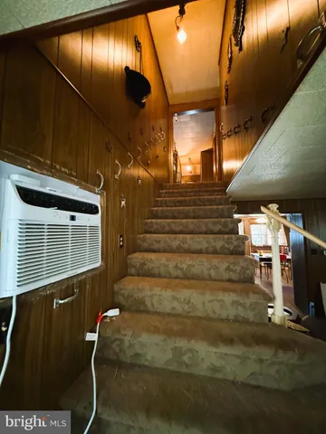 a spacious bedroom with a bed and window