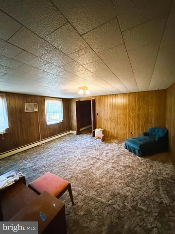 a view of a room with wooden walls