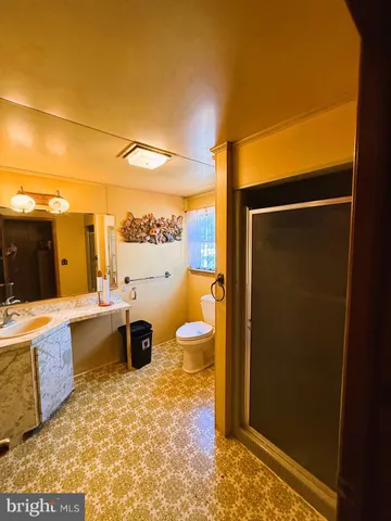 a kitchen with a refrigerator and breakfast area