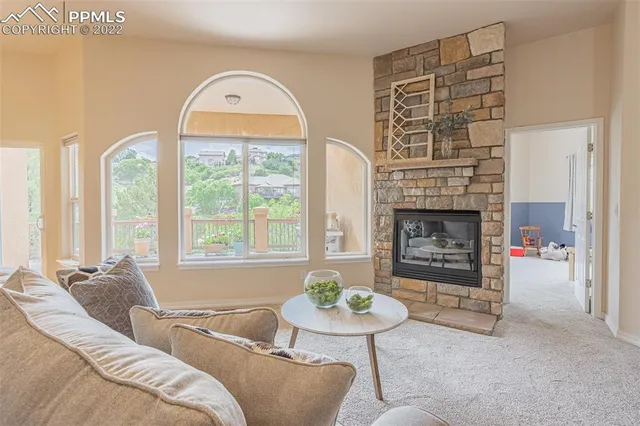 a view of a dining room with furniture and chandelier