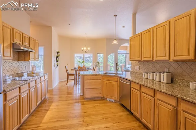 a spacious bedroom with a bed and a large window