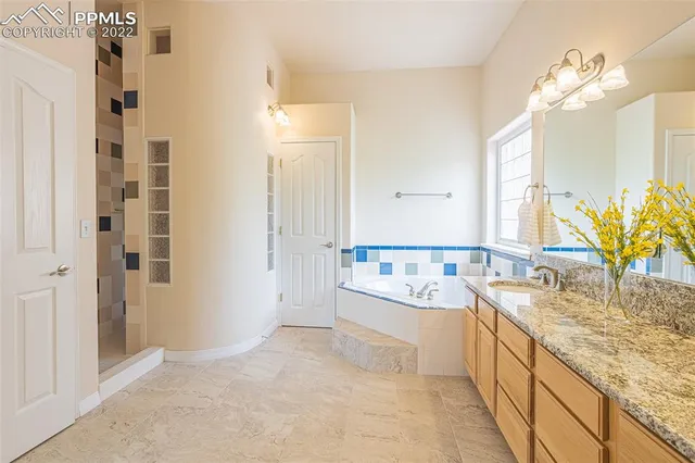 a living room with furniture a stove a dining table and kitchen view