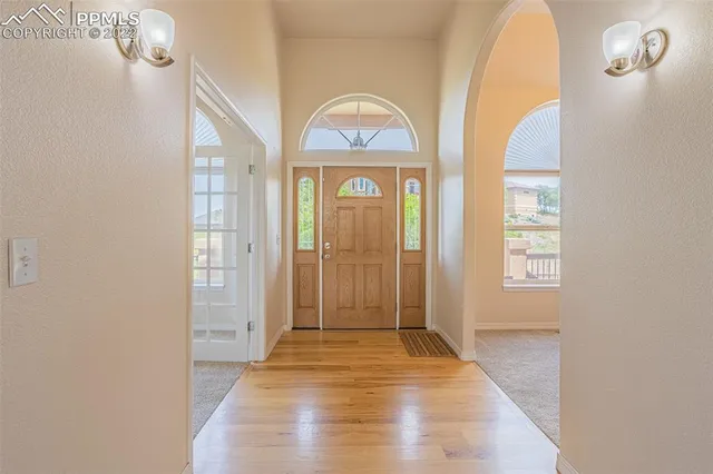 a dining room with furniture and a window