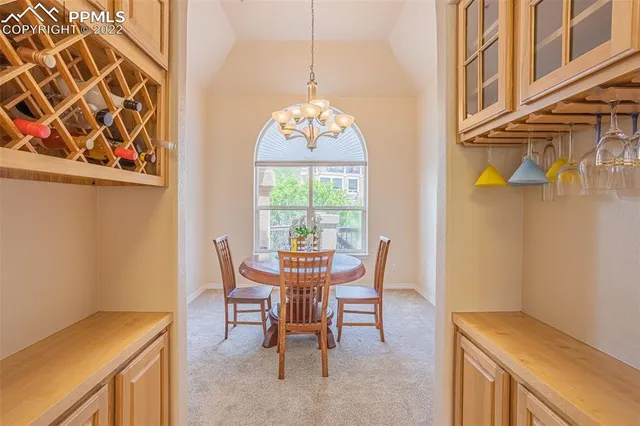 a large kitchen with stainless steel appliances granite countertop a stove top oven a sink dishwasher and cabinets with wooden floor