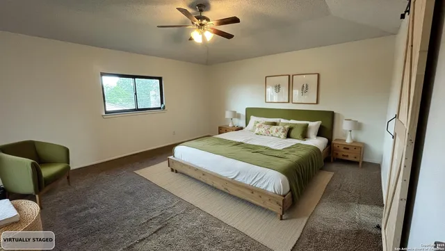 a bedroom with a bed and window