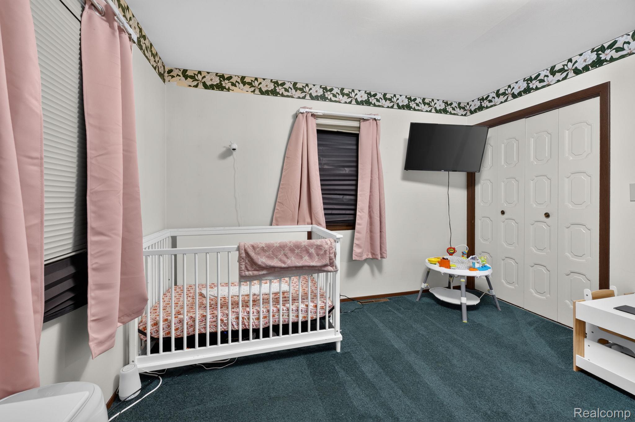 5330 Sheridan Road Saginaw, MI 48601 - Photo 34 of 50 Carpeted interior space featuring white walls and a decorative wallpaper border