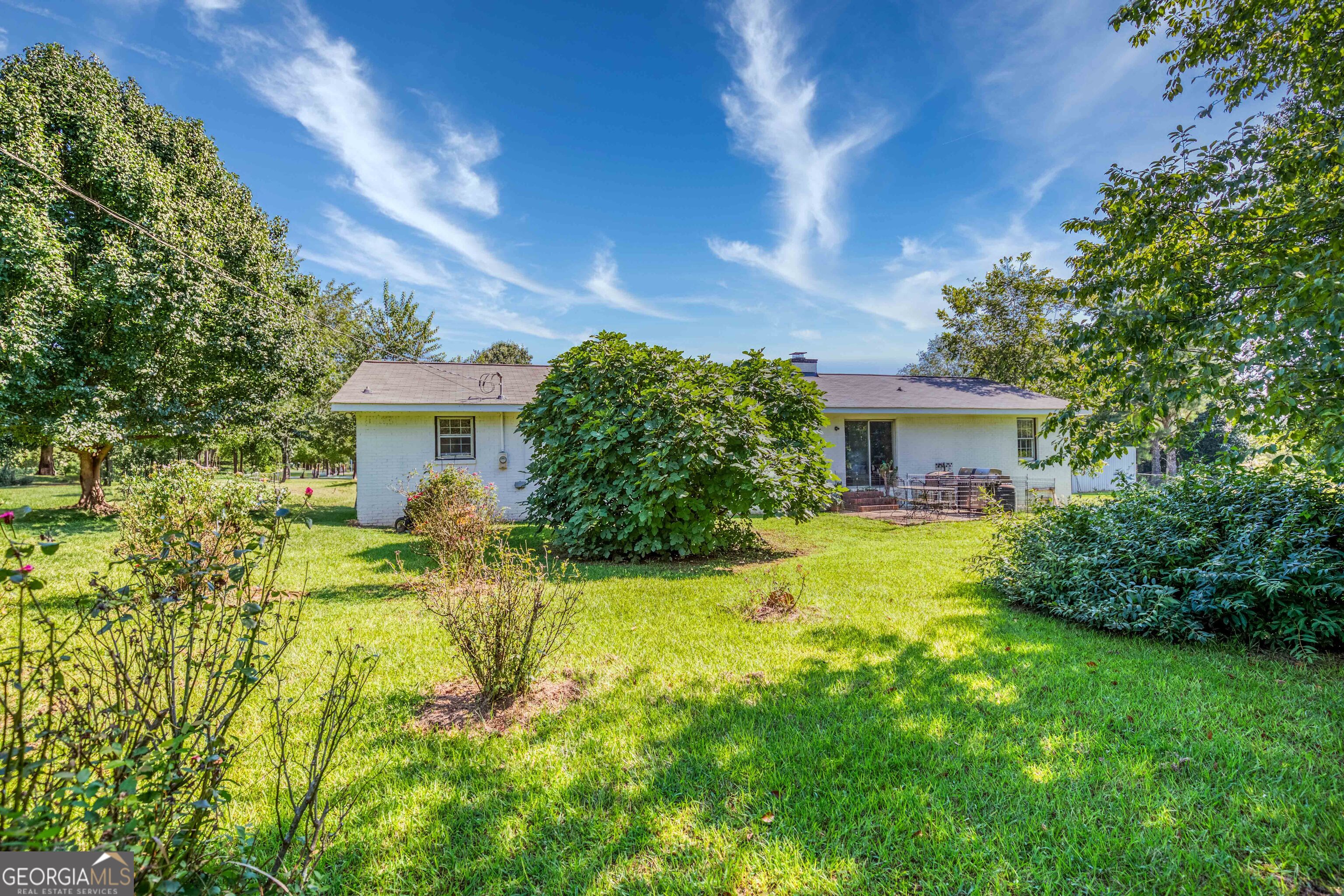 2141 Greensboro Road Madison, GA 30650 - Photo 12 of 35 a front view of a house with garden
