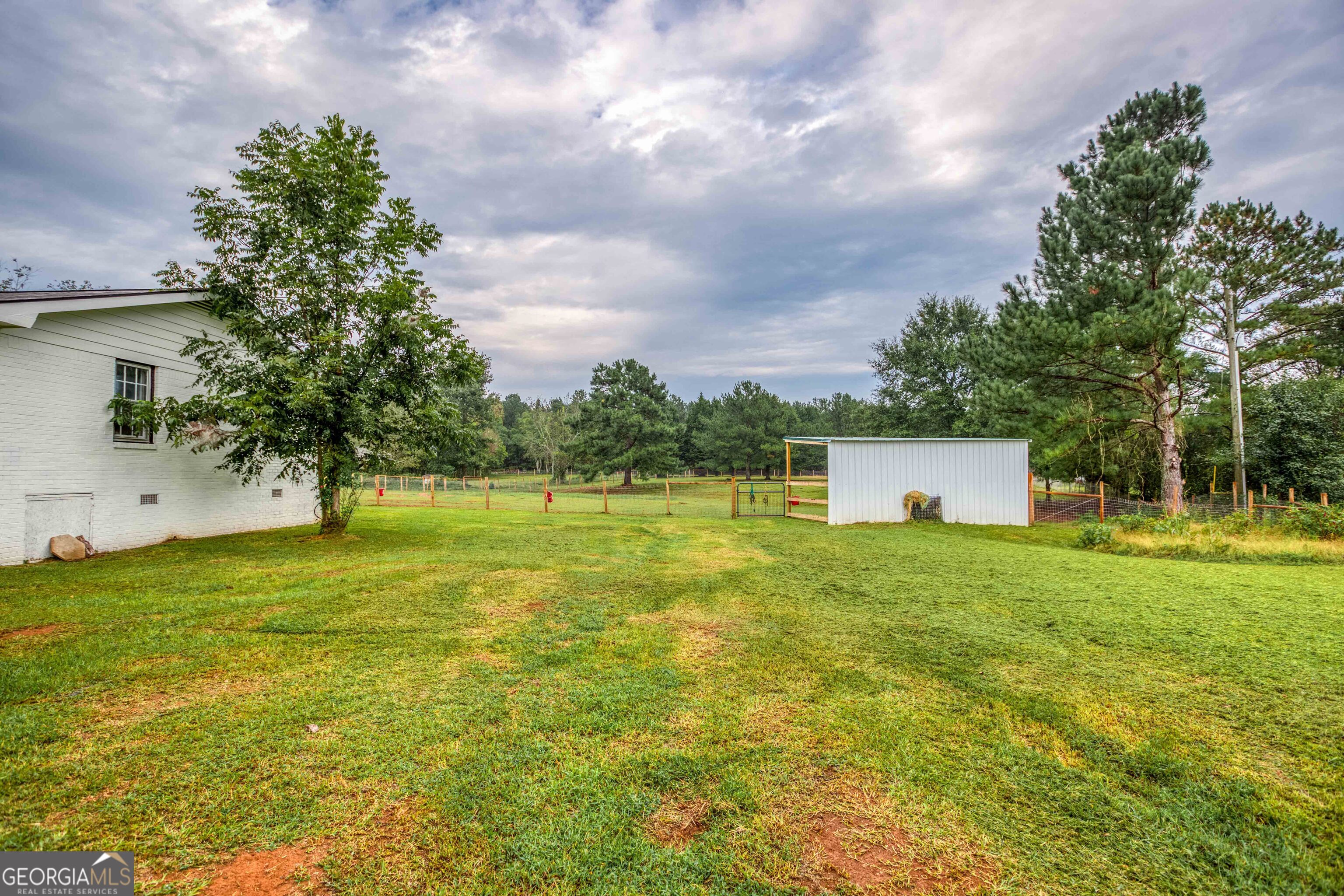 2141 Greensboro Road Madison, GA 30650 - Photo 19 of 35 a fire hydrant in the middle of a field
