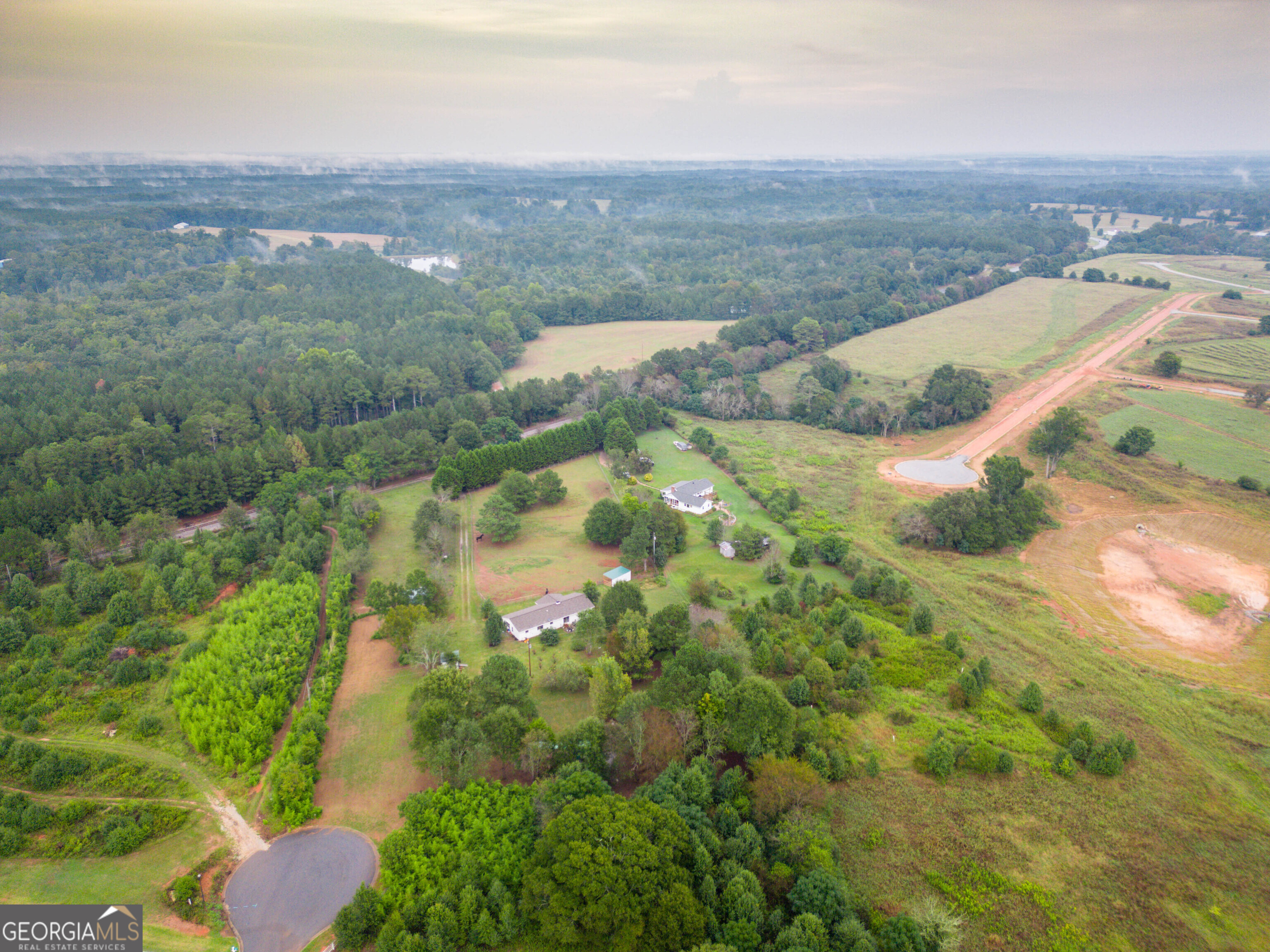 2141 Greensboro Road Madison, GA 30650 - Photo 5 of 35 an aerial view of a houses with a yard